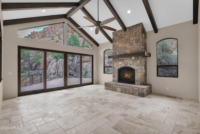 4393 N Twisted Trl, Prescott, AZ 86301 - unfurnished living room featuring high vaulted ceiling, beam ceiling, ceiling fan, stone finish flooring, and a fireplace
