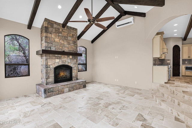 4393 N Twisted Trl, Prescott, AZ 86301 - living room featuring a wall mounted AC, high vaulted ceiling, a fireplace, a ceiling fan, and arched walkways