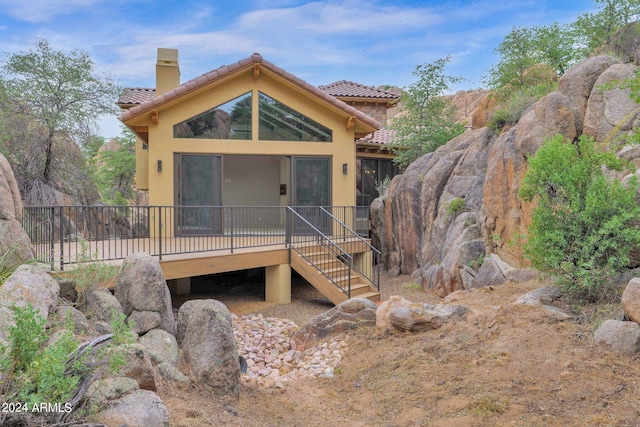 4393 N Twisted Trl, Prescott, AZ 86301 - rear view of property featuring a tiled roof, stucco siding, a deck, and a chimney