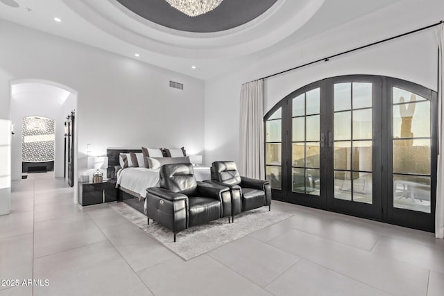 bedroom with visible vents, recessed lighting, arched walkways, an inviting chandelier, and a raised ceiling