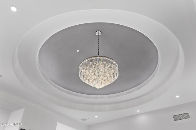 details with visible vents, recessed lighting, and an inviting chandelier