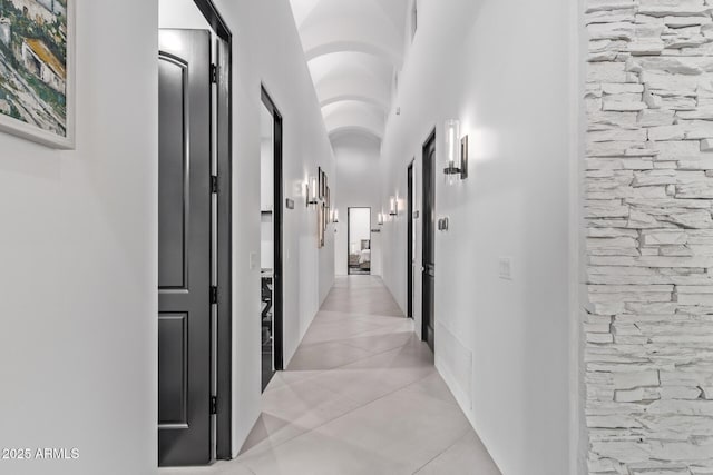 hall featuring light tile patterned floors