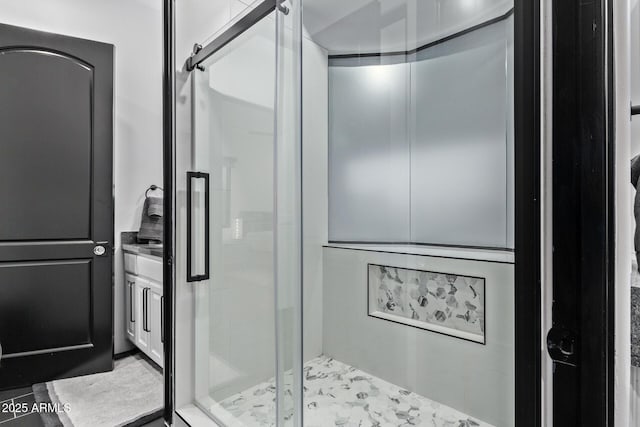 full bathroom with vanity and a shower stall