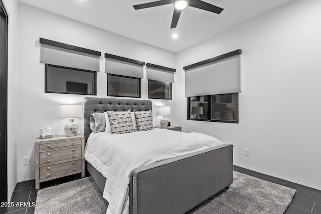 bedroom featuring recessed lighting, a ceiling fan, and dark tile patterned flooring