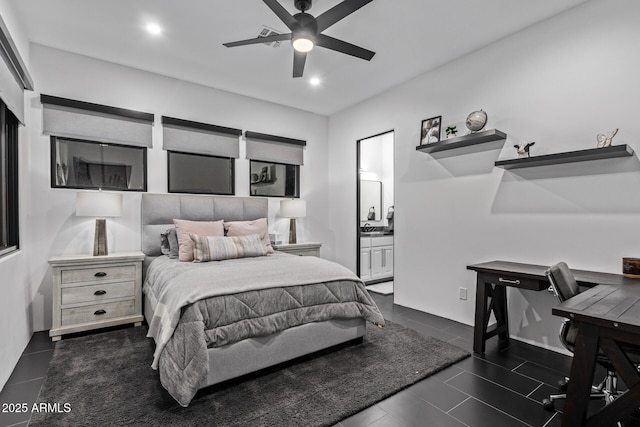 bedroom featuring a ceiling fan, ensuite bath, dark tile patterned flooring, and recessed lighting