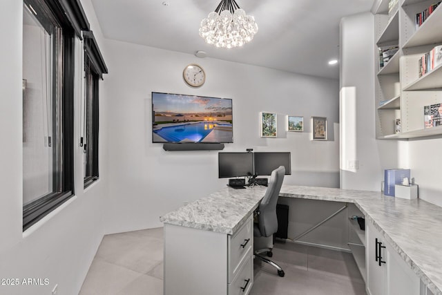 office with a chandelier, built in desk, recessed lighting, and light tile patterned floors