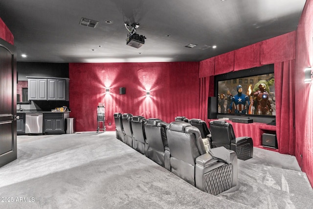 home theater room with carpet and visible vents