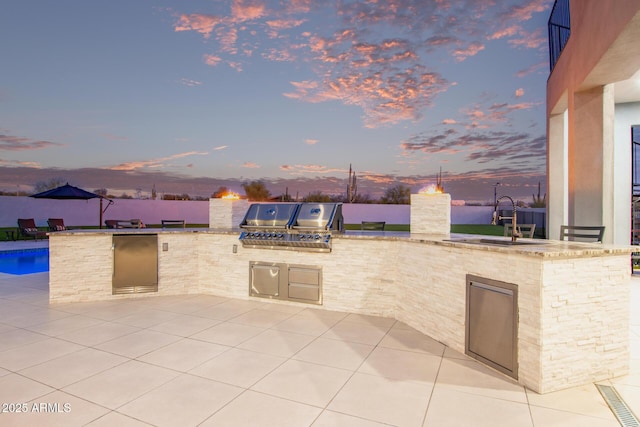 view of patio featuring a sink and area for grilling