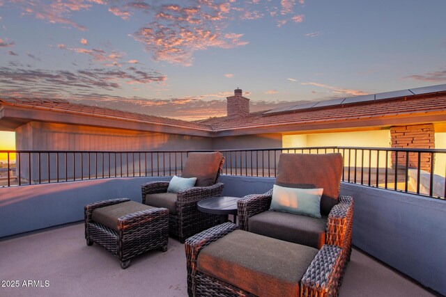 view of patio terrace at dusk