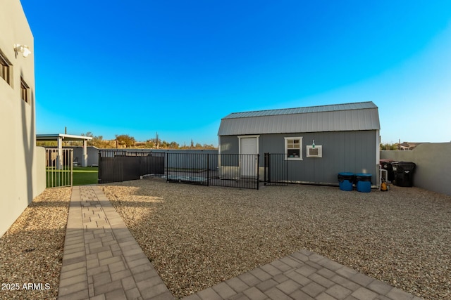 view of yard with an outbuilding and a fenced backyard