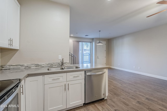 kitchen featuring sink, white cabinetry, and stainless steel appliances