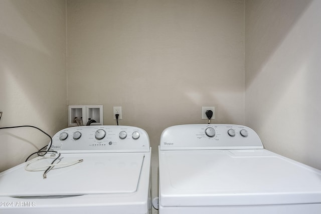 clothes washing area featuring independent washer and dryer