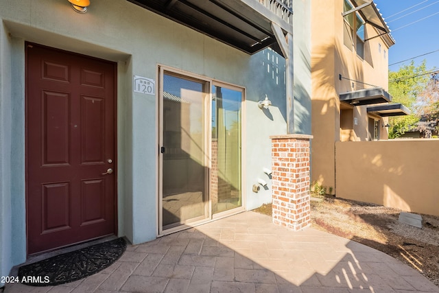 entrance to property with a patio