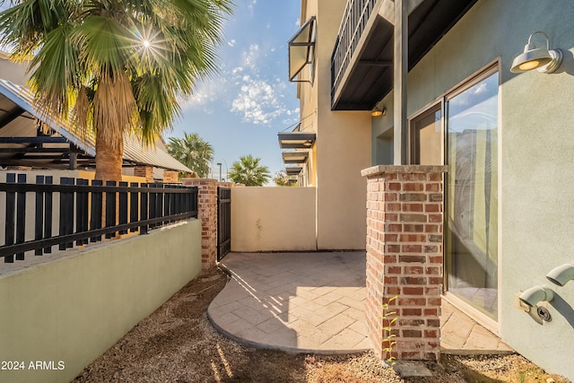 view of property exterior featuring a patio area