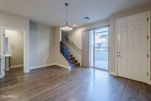 entrance foyer with dark hardwood / wood-style flooring