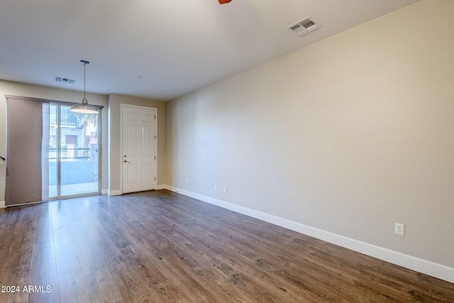 spare room with dark wood-type flooring