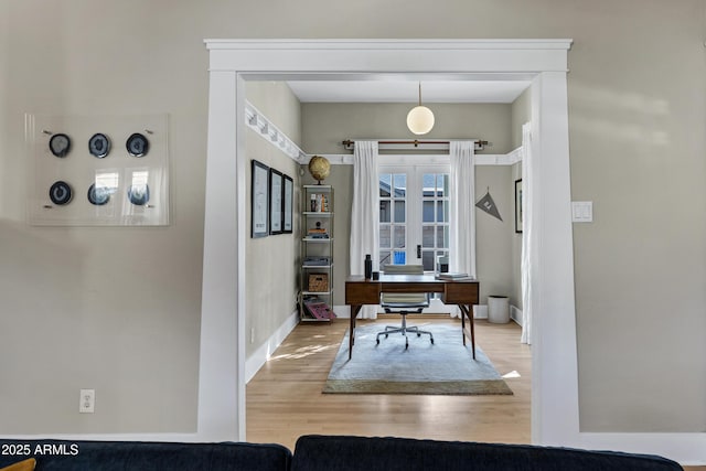 office with baseboards and wood finished floors