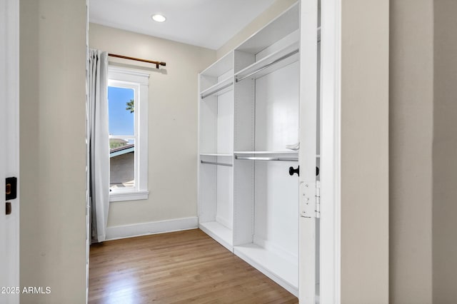 spacious closet featuring light wood-style floors