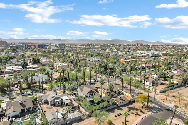 drone / aerial view featuring a residential view and a mountain view