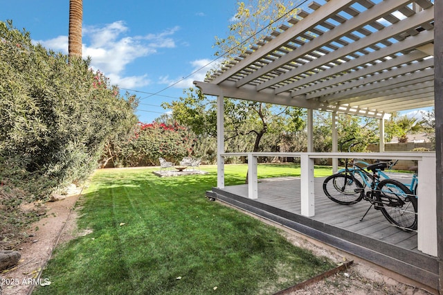 view of yard featuring a wooden deck and a pergola