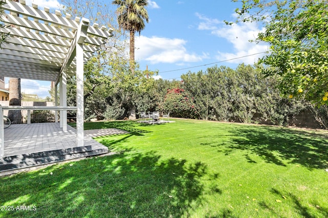 view of yard featuring a deck and a pergola