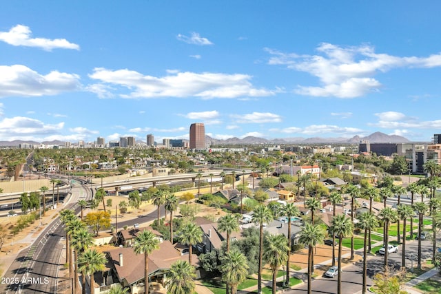 drone / aerial view with a view of city and a mountain view