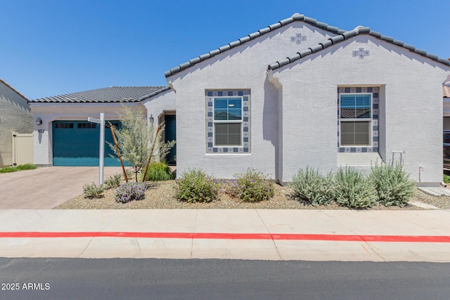 3852 E Bartlett Way, Chandler, AZ 85249 - mediterranean / spanish home featuring stucco siding, an attached garage, a tiled roof, and driveway