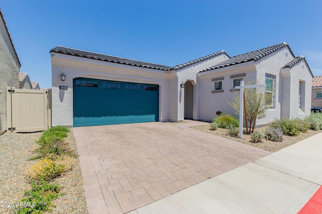 3852 E Bartlett Way, Chandler, AZ 85249 - view of front facade with an attached garage, stucco siding, decorative driveway, and a tile roof