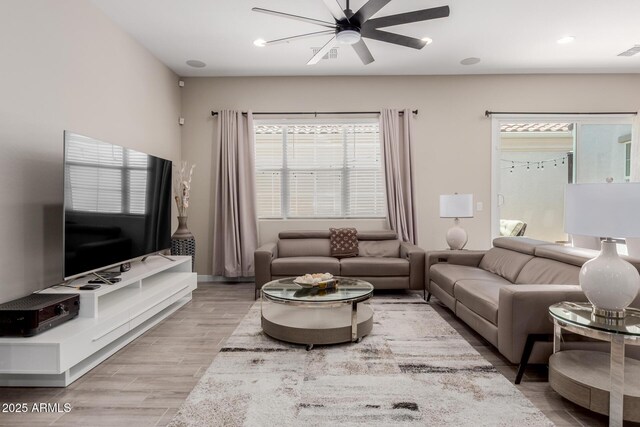 3852 E Bartlett Way, Chandler, AZ 85249 - living area with ceiling fan, plenty of natural light, light wood finished floors, and recessed lighting