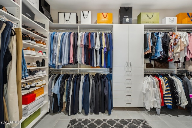 spacious closet featuring tile patterned floors