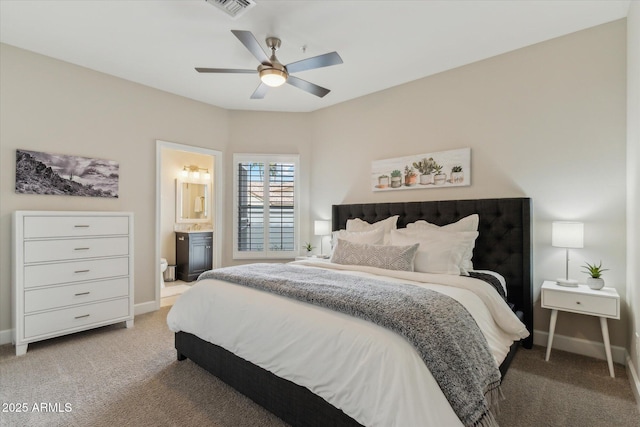 bedroom featuring light colored carpet, connected bathroom, visible vents, and baseboards