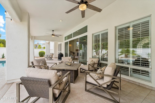 view of patio with outdoor lounge area and a ceiling fan