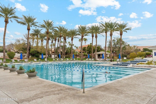 community pool with a patio area