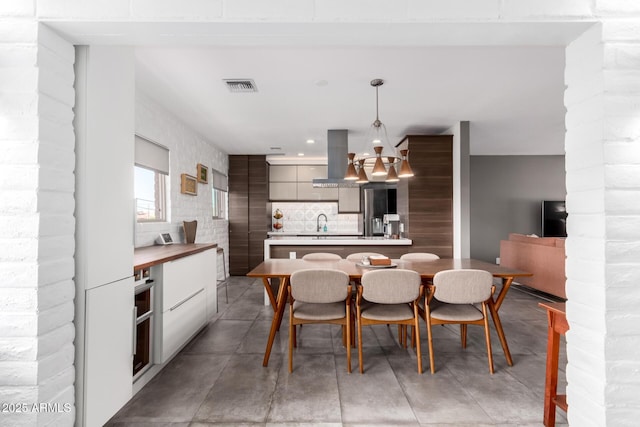 dining space with recessed lighting, visible vents, and light tile patterned flooring