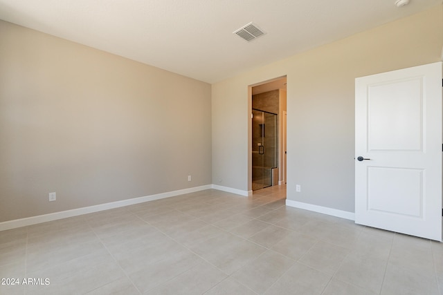 unfurnished bedroom with light tile patterned floors