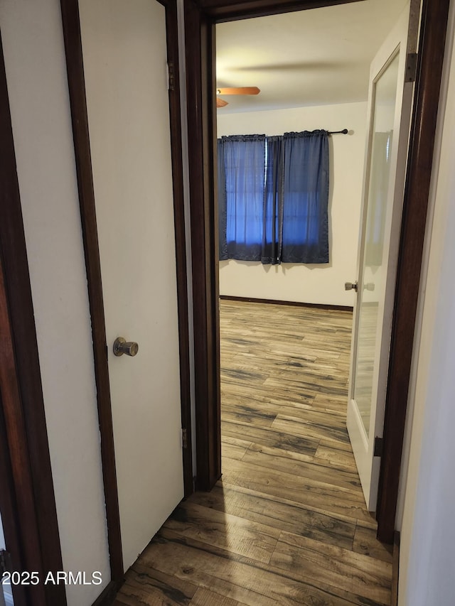 hallway with wood finished floors