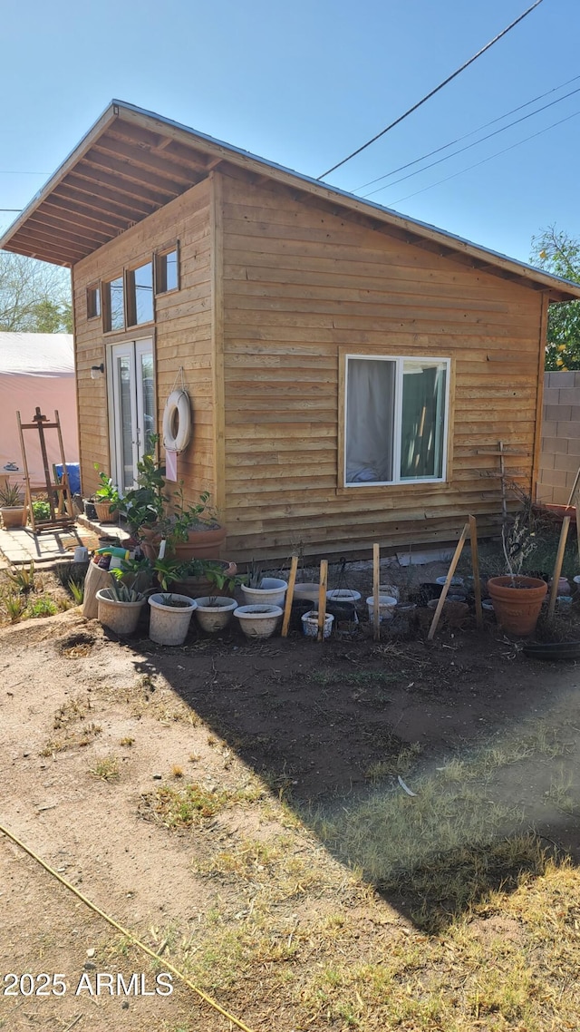 view of side of home with french doors