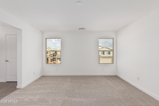 empty room with carpet flooring