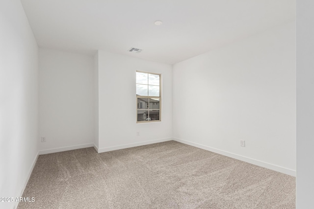 unfurnished room featuring carpet