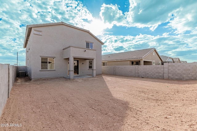 back of property featuring a patio area and central air condition unit