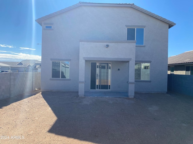 rear view of property featuring a patio area