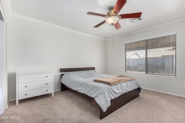 carpeted bedroom featuring baseboards, ceiling fan, visible vents, and crown molding