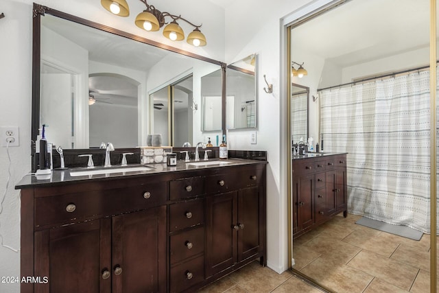 full bath with a ceiling fan, tile patterned flooring, a sink, and double vanity