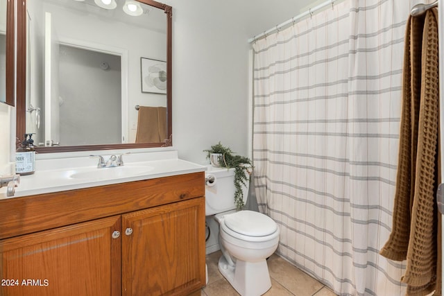 full bathroom with toilet, curtained shower, vanity, and tile patterned floors