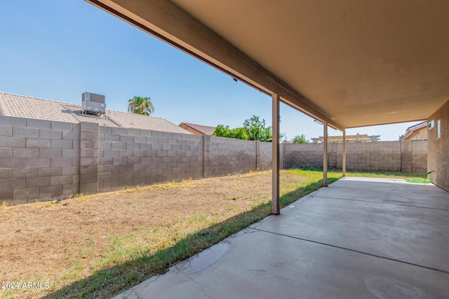 view of patio with a fenced backyard and cooling unit