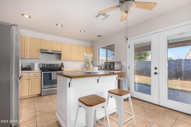 kitchen featuring french doors, stainless steel appliances, visible vents, light brown cabinets, and under cabinet range hood