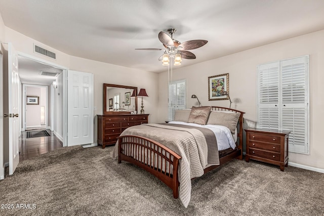 8219 E Morgan Trl, Scottsdale, AZ 85258 - carpeted bedroom with baseboards and ceiling fan