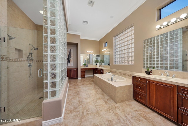 full bathroom featuring a shower stall, visible vents, and crown molding