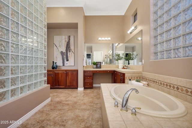 full bath featuring baseboards, vanity, a bath, and crown molding