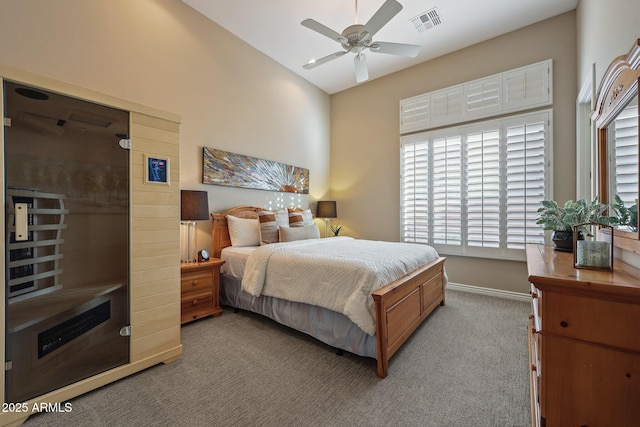 bedroom featuring visible vents, baseboards, lofted ceiling, a sauna, and carpet